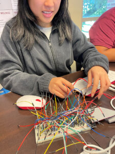 students working with electronics